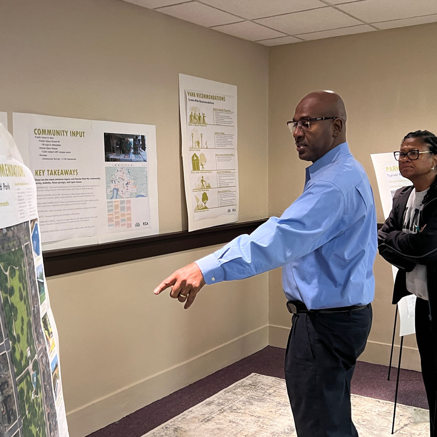 James Mosley presenting project map with colleague, demonstrating leadership on major infrastructure projects